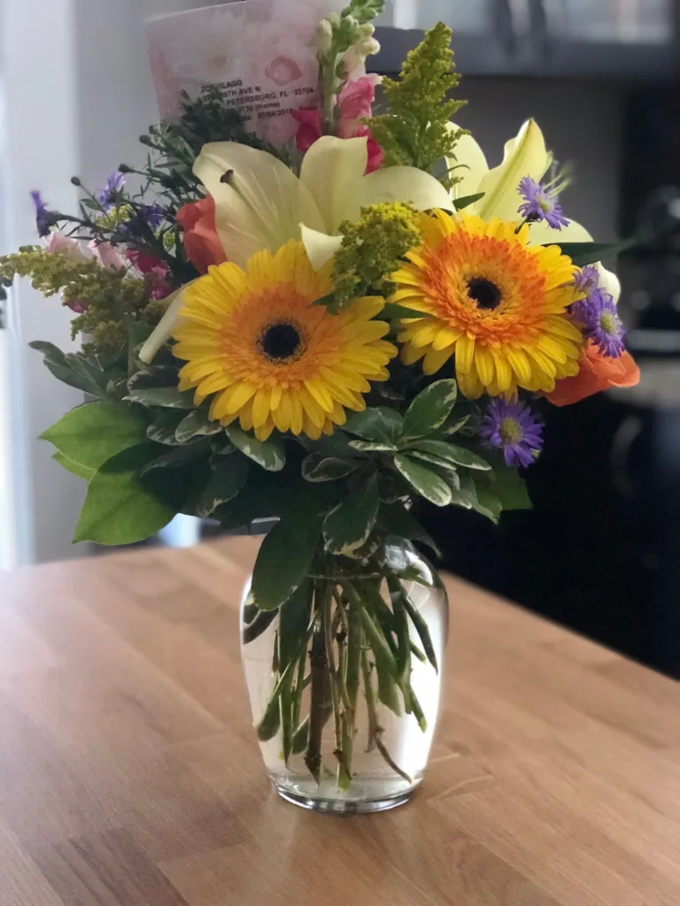 Bouquet of flowers in vase in kitchen