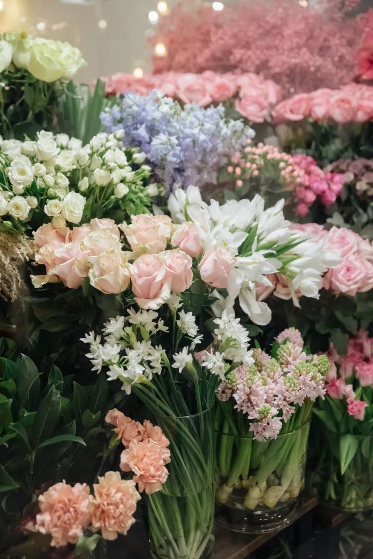 Flower shop. Different varieties fresh spring flowers in refrigerator room for flowers.