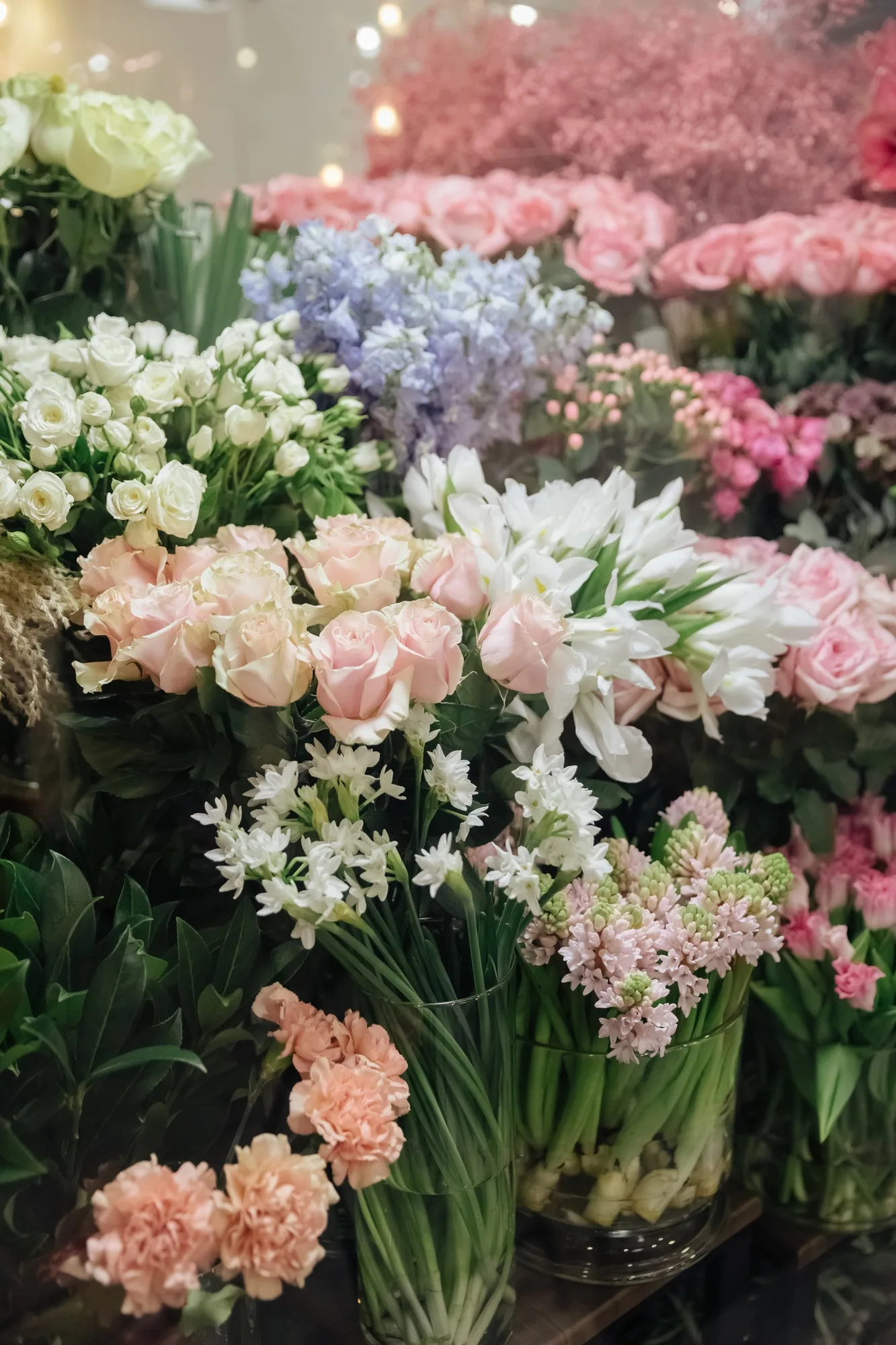 Flower shop. Different varieties fresh spring flowers in refrigerator room for flowers.
